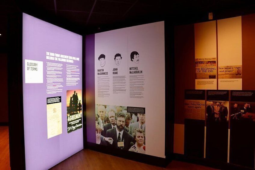 An exhibition with panels, posters, and photographs. 2