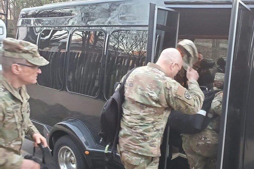 Soldiers disembarking from a military vehicle. 2