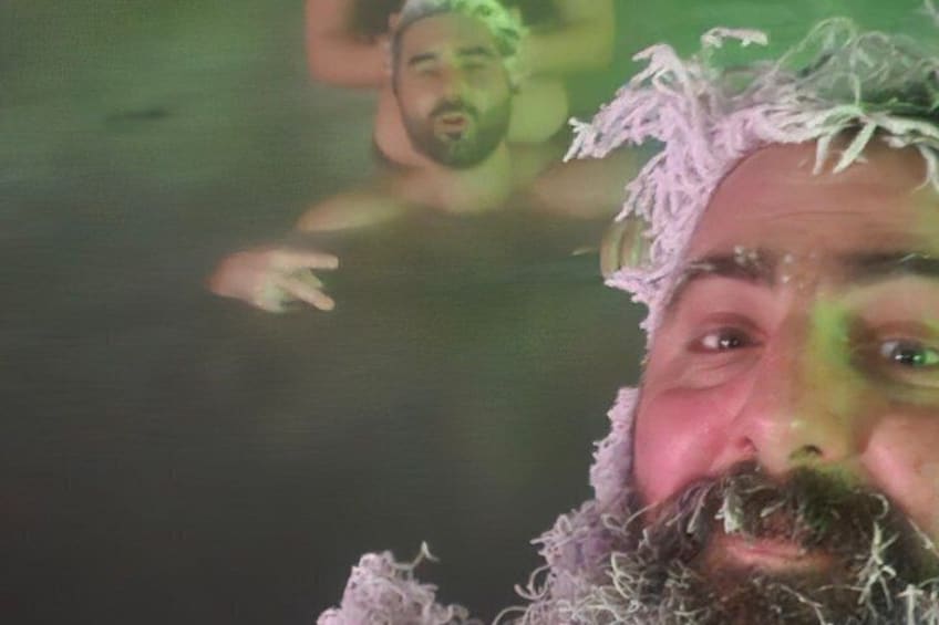 A person with a beard and a head covering in a body of water. 5