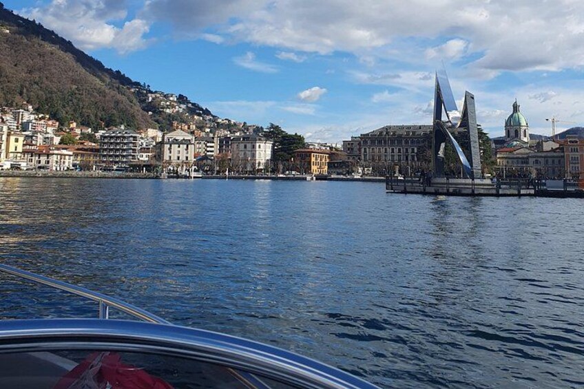 A body of water with a bridge and buildings in the background. 2