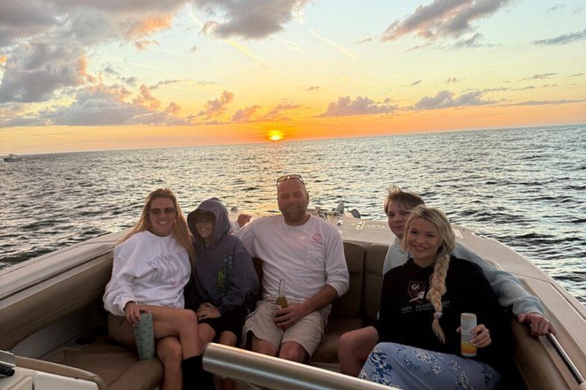 Family picture of sunset on a Sunset tour at anna maria island. 2