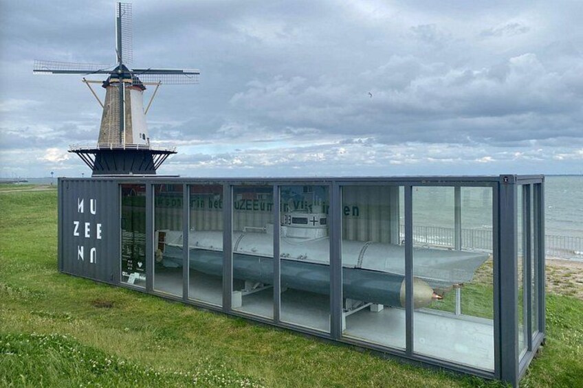 A museum with a windmill in the background. 3
