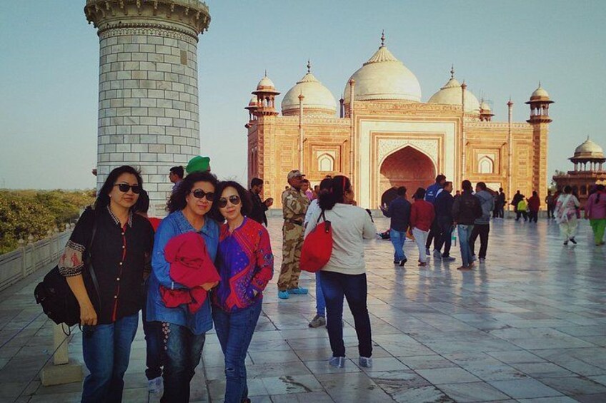 The Taj Mahal with tourists in the foreground. 1