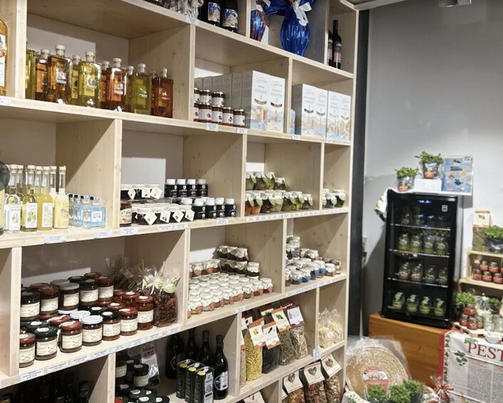 Shelves stocked with various food products and condiments. 3
