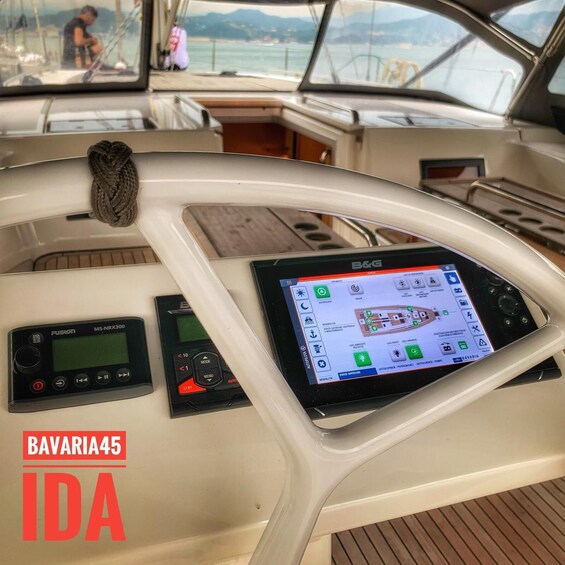 A boat's control panel with a screen displaying a map and various controls. 5
