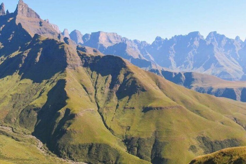 A mountainous landscape with rugged peaks and valleys. 3