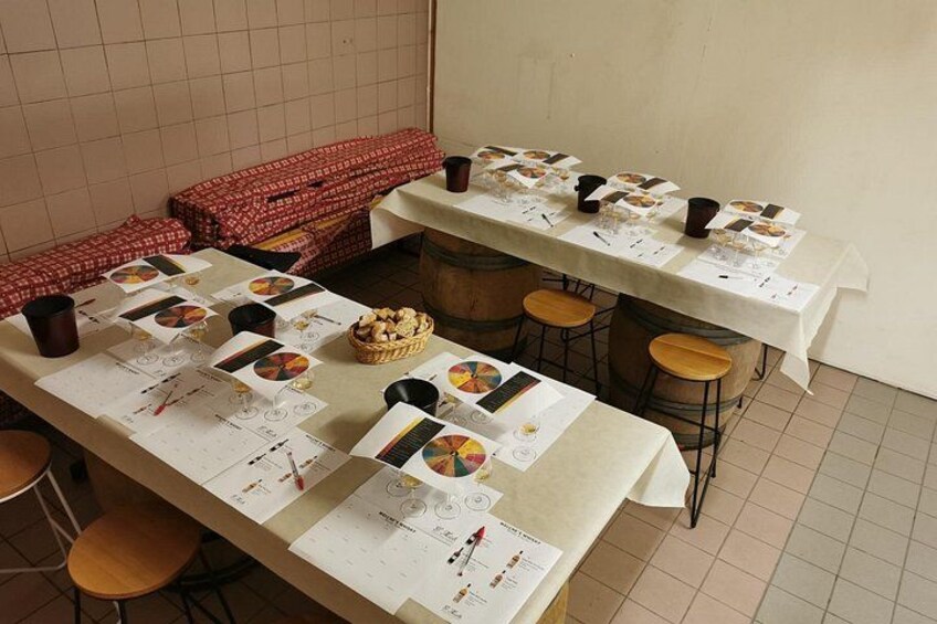 A long table with papers, charts, and a basket of bread. 4