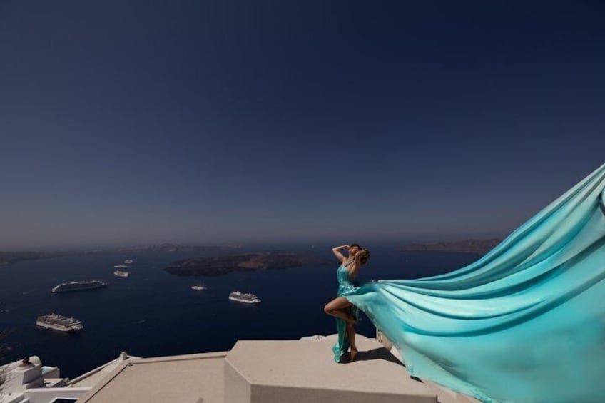 Turquoise dress over caldera with deep blue sky 4