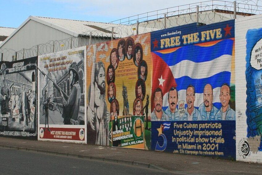 A mural with political messages and portraits. 3