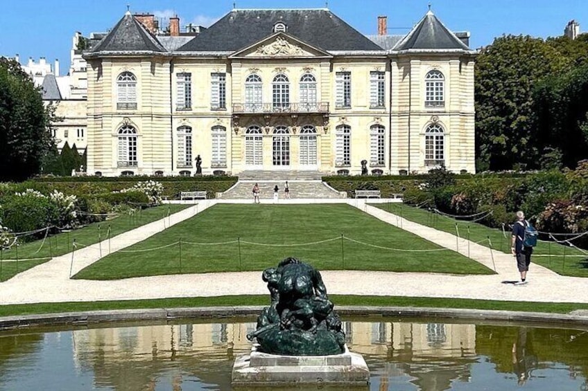 A large historic building with a fountain in the foreground. 4