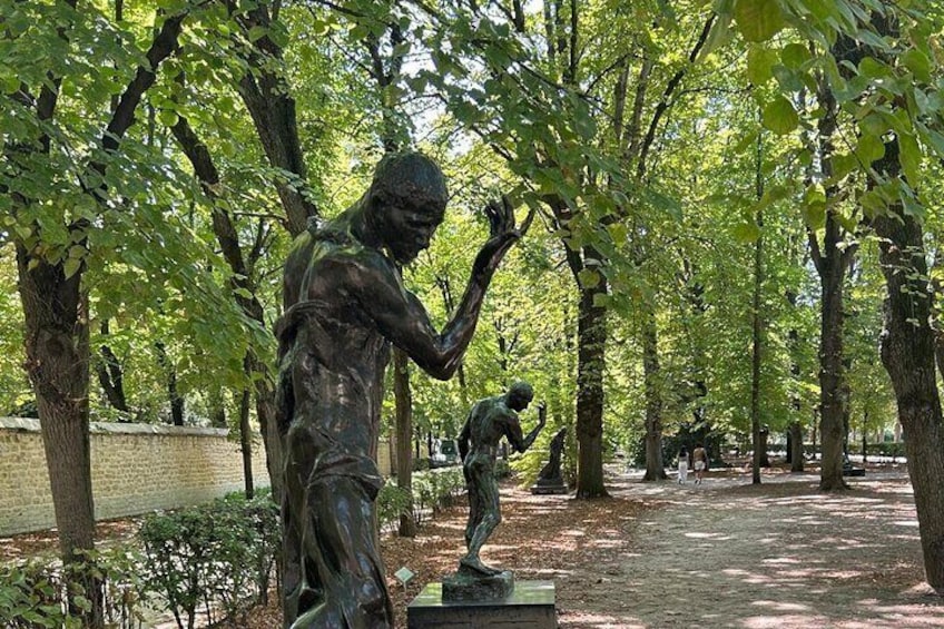A park with bronze statues of children playing. 5