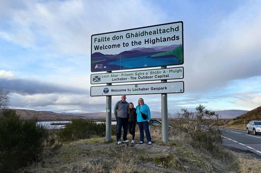 A sign welcoming visitors to the Highlands with Lochaber, the Outdoor Capital, and Lochaber Geopark mentioned. 5