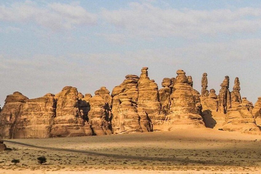 A desert landscape with prominent rock formations. 2