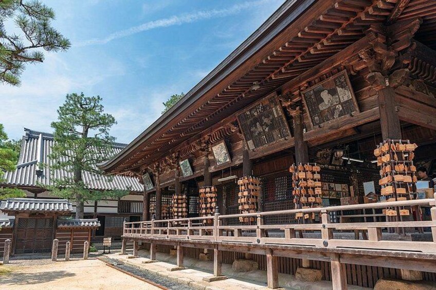 A traditional Japanese building with wooden beams and a tiled roof. 3