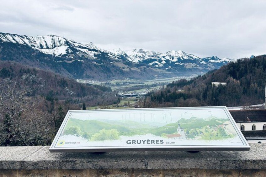 A map of Gruyeres with a mountainous backdrop. 2