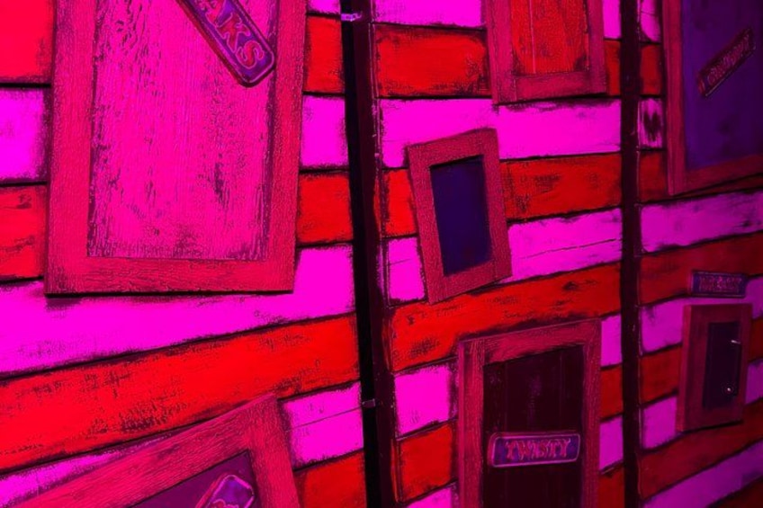 A wall with wooden panels and rectangular cutouts. 1