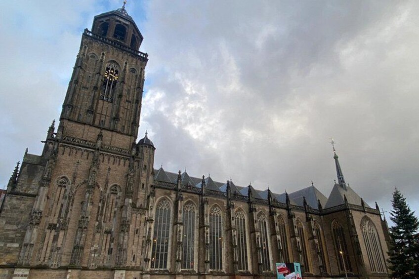 A large historic church with a prominent clock tower and Gothic architecture. 5