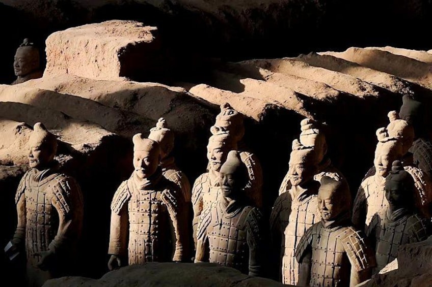 Terracotta soldiers in a row, standing in a cave. 2