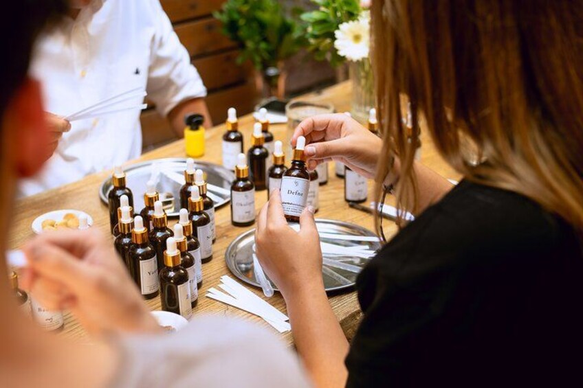 People tasting different samples of a product at a table. 3