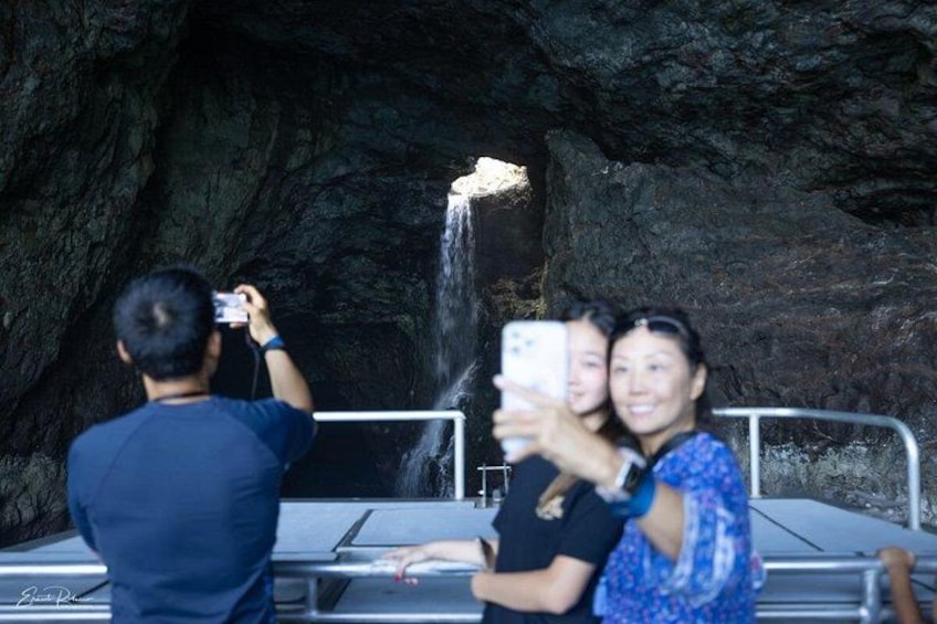 A cave with a waterfall. 2