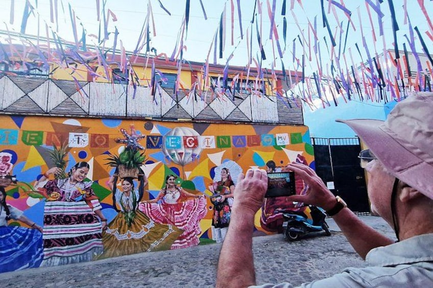 A traveler is capturing moments during my STREET ART TOUR in OAXACA 5