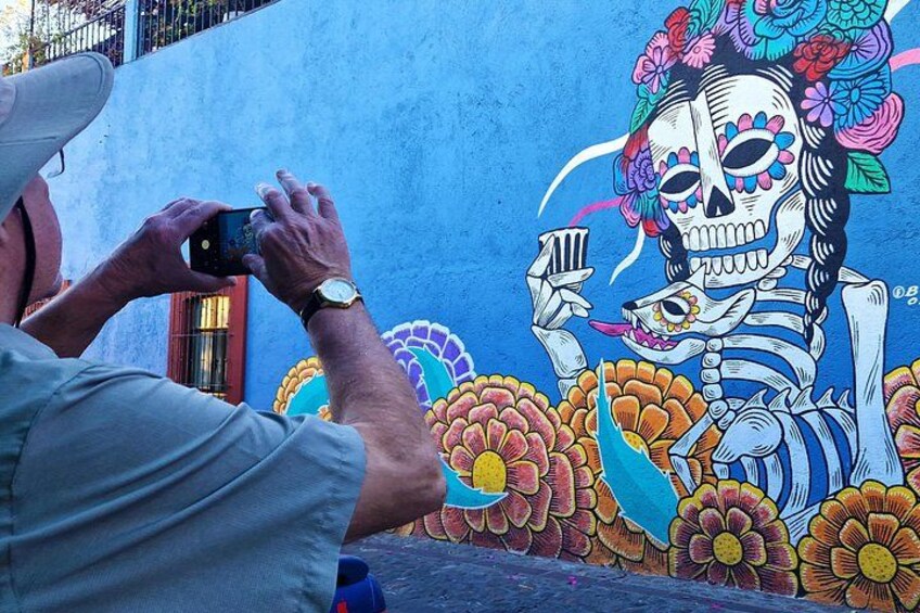 A traveler is capturing moments during my STREET ART TOUR in OAXACA 4