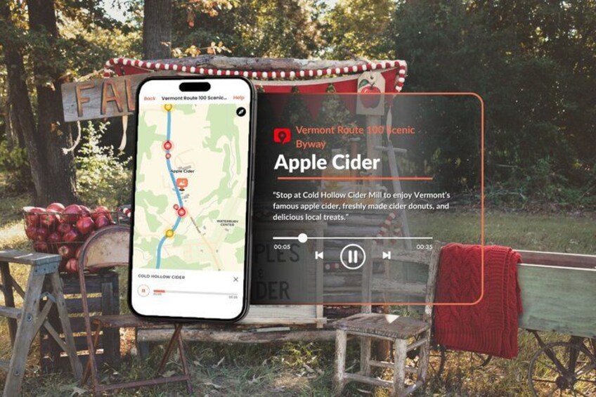 Un teléfono inteligente mostrando un mapa con una ruta, un molino de sidra y un cartel anunciando sidra de manzana. 4