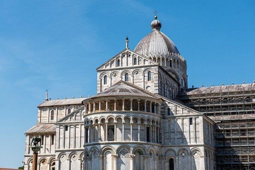 A large, historic building with a prominent dome and intricate architectural details. 5