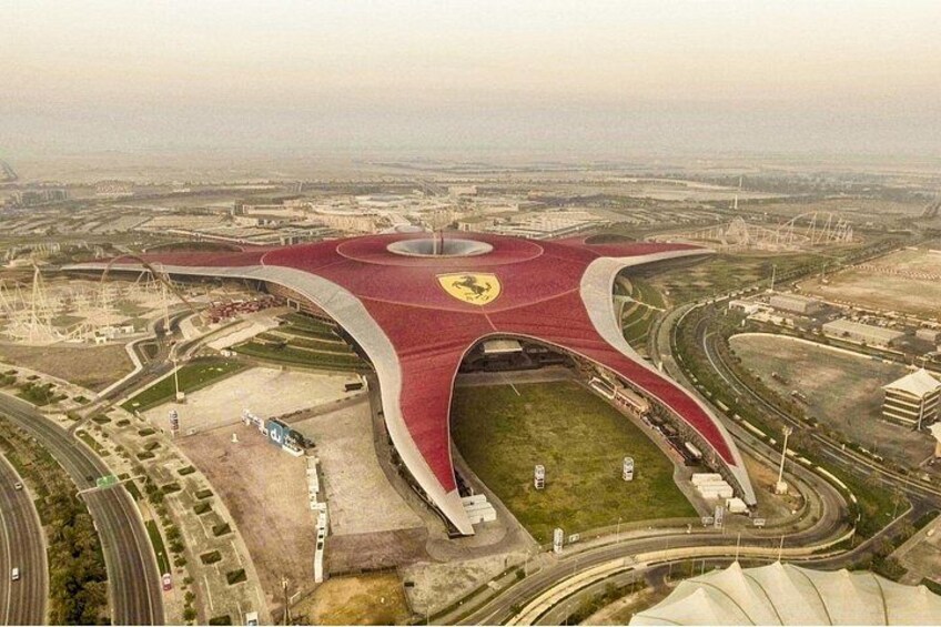 A stadium with a distinctive red roof and a Ferrari logo. 2