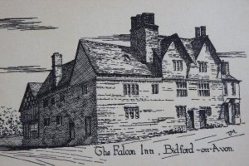 A traditional building with a stone facade, multiple chimneys, and a sign indicating it is the Falcon Inn in Bedford-on-Avon. 2