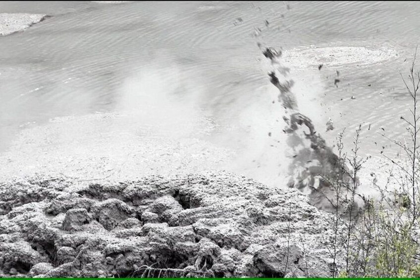 A geyser eruption with water and steam. 3