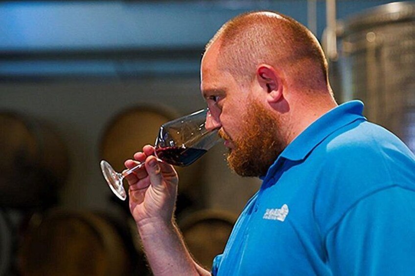 A person holding a wine glass. 2