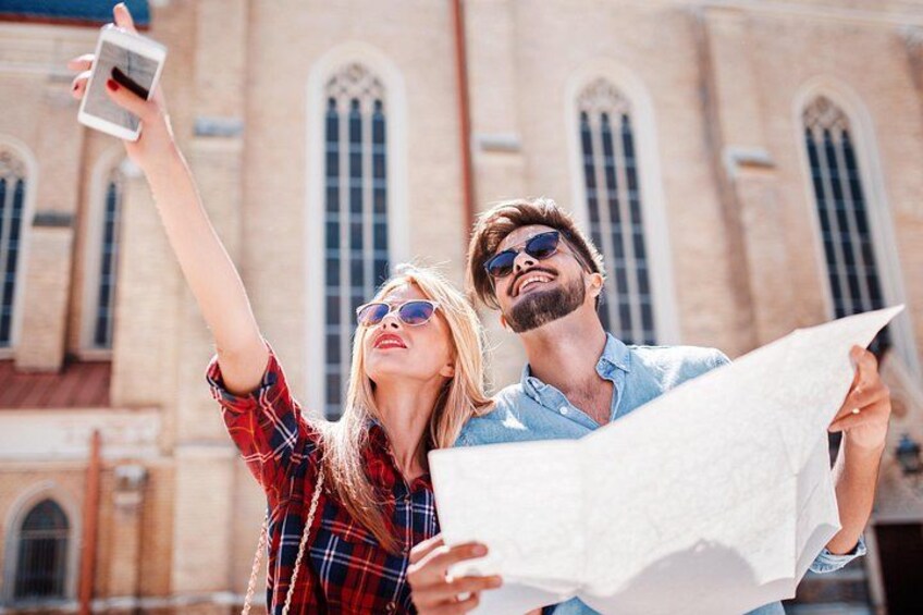 Two people taking a selfie with a map. 5