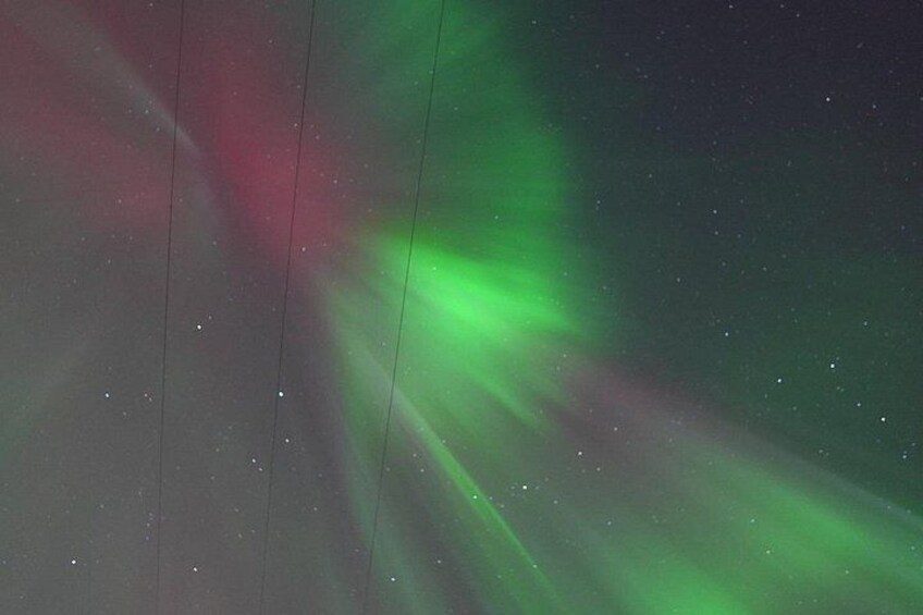 The aurora borealis with green and red hues. 2