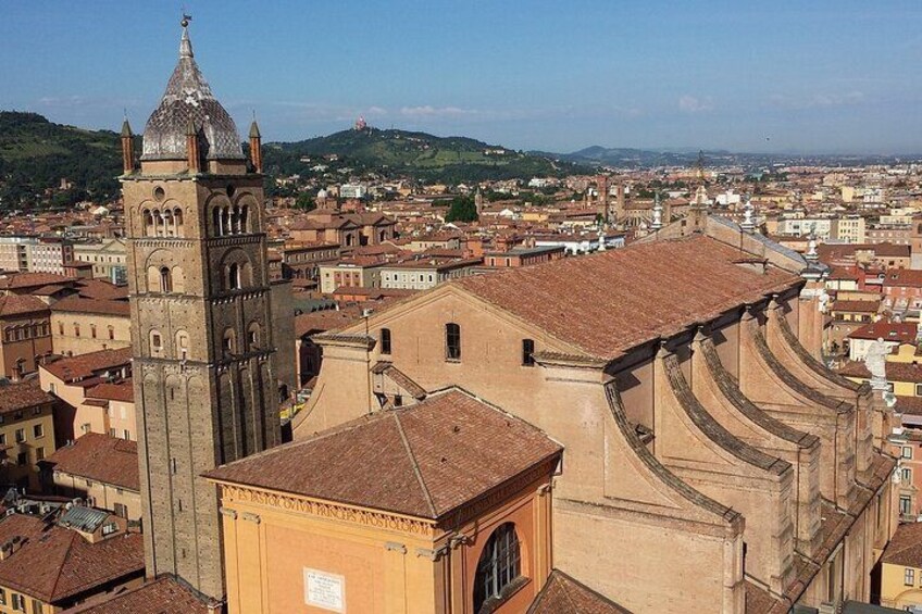 A historic cityscape with a prominent church featuring a bell tower and a large dome. 5