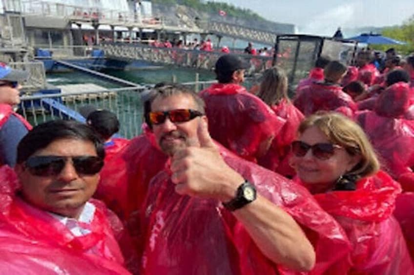 People in rain ponchos at an outdoor event. 4