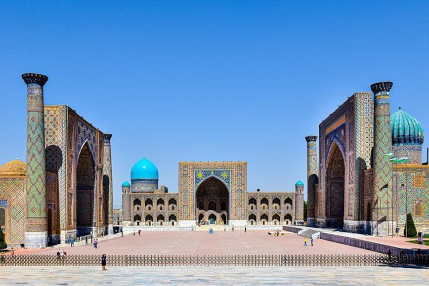 A historic building with intricate tile work and domes. 2