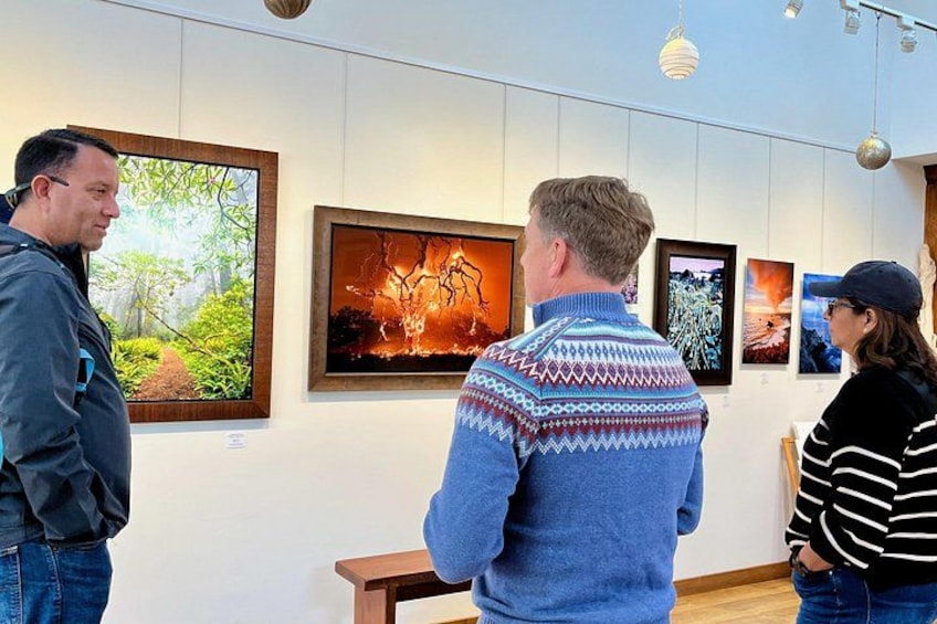 A gallery with framed artworks on display. 2