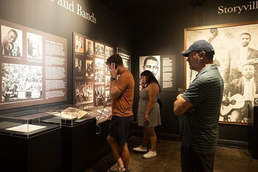 An exhibition with historical photographs and text panels. 3