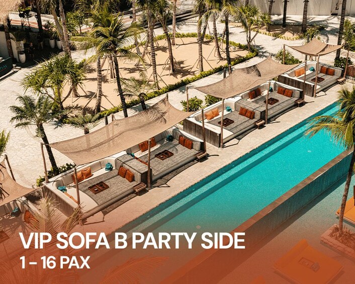 A poolside area with VIP sofas and palm trees. 5