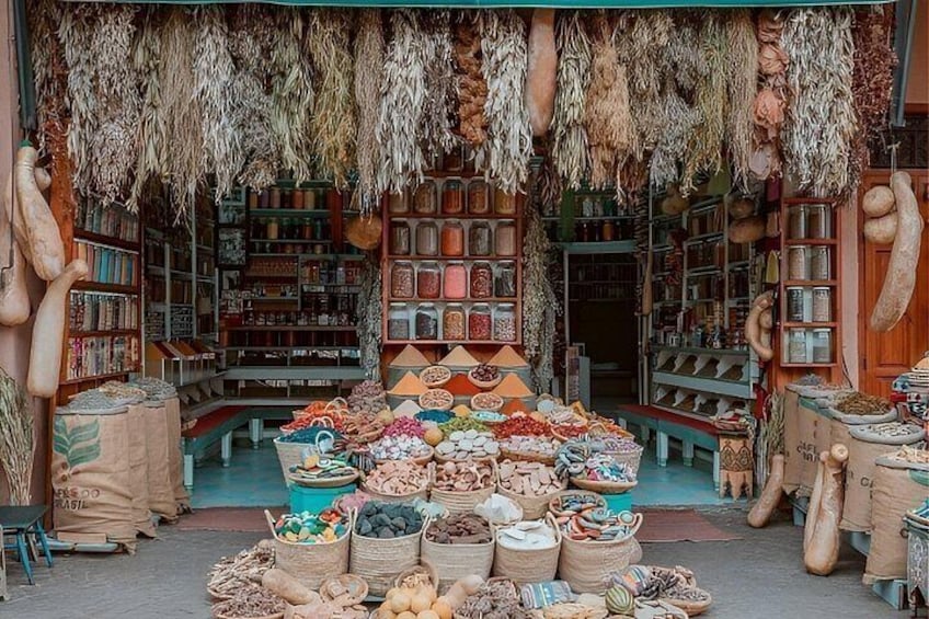 A market with various food items and hanging dried goods. 5