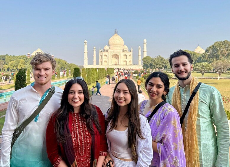 A group of people in front of the Taj Mahal. 1