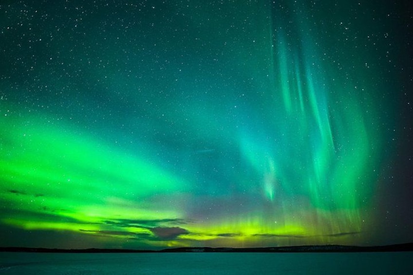 The Northern Lights over a snowy landscape. 5