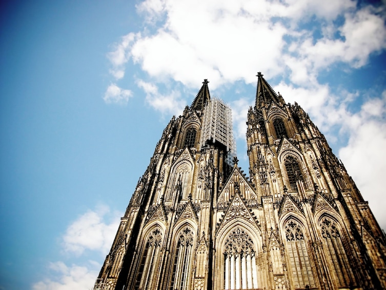 A Gothic cathedral with intricate architecture and a clear blue sky. 5