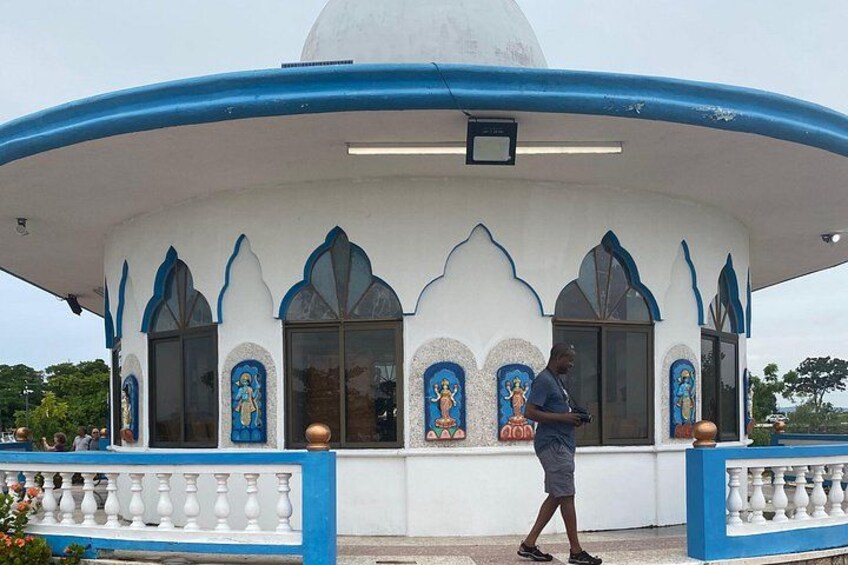 A white and blue building with arched windows and a dome. 5
