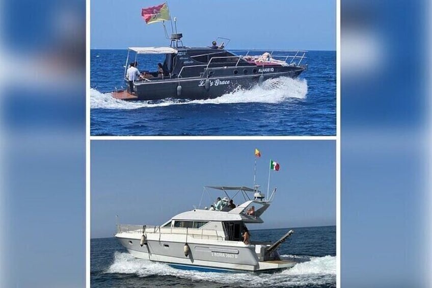 A speedboat with a flag, a person on the deck, and another boat with flags in the background. 1