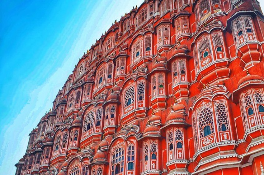 A large, ornate building with intricate architectural details and multiple windows. 4