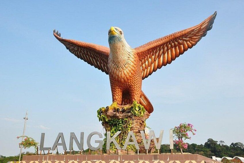A large eagle statue with outstretched wings on a pedestal. 5