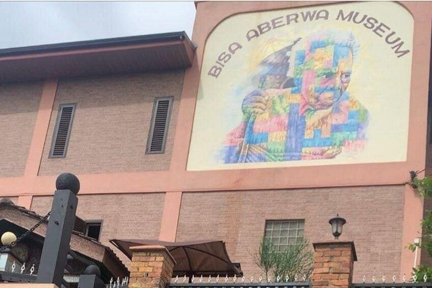 The exterior of the Bosa Aberwa Museum with a colorful mural. 3