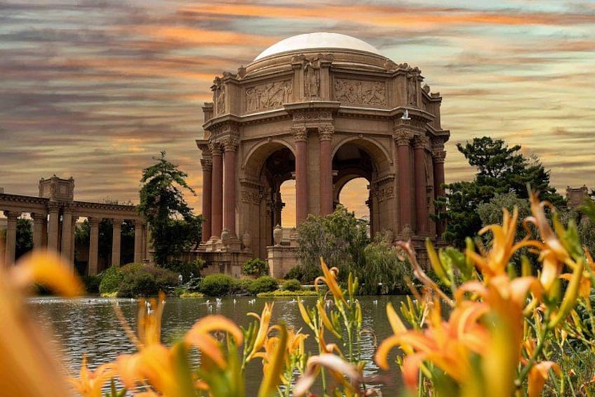 A large, ornate building with a dome, surrounded by water and greenery. 5